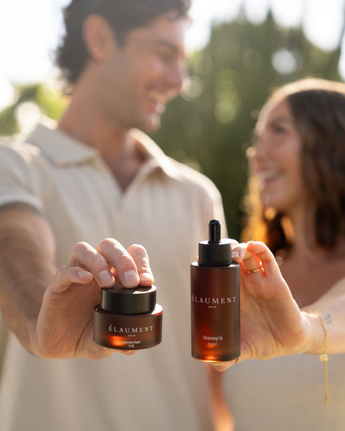 A couple holding the Élaument Skin Cleansing Oil and Hydration Balm together