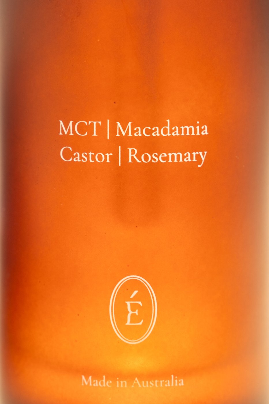 The Élaument Cleansing Oil label reading MCT, macadamia, castor, rosemary